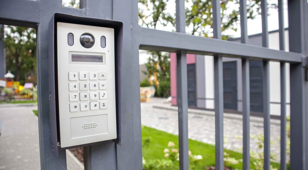 an intercom on a gate used for access control