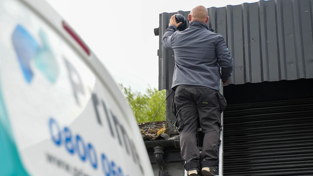 a cctv engineer installing a cctv system