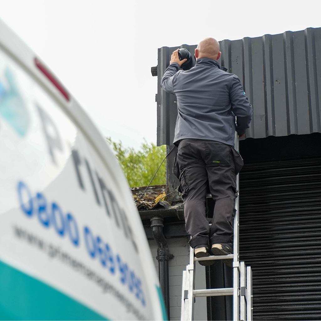 A CCTV engineer installing CCTV