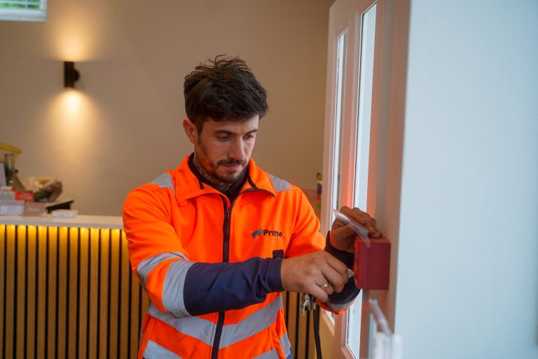 an engineer maintaining a fire alarm system